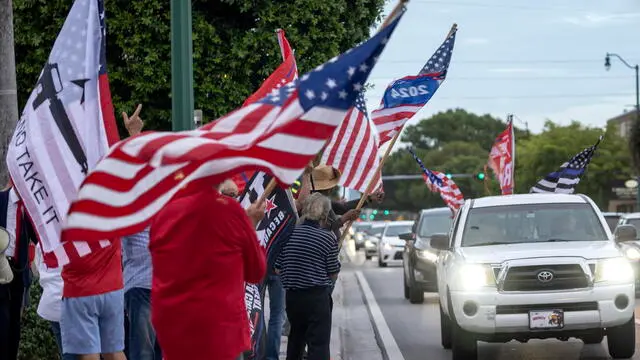 epa11476793 Supporters of former US President Donald Trump hold a demonstration in his support in Miami, Florida, USA, 13 July 2024. Trump was rushed off stage by secret service after an incident during a campaign rally in Pennsylvania. According to the Butler County district attorney a suspected gunman was dead and at least one rally attendee was killed. According to a statement by a secret service spokesperson, the former President is safe and further information on the incident will be released when available. EPA/CRISTOBAL HERRERA-ULASHKEVICH