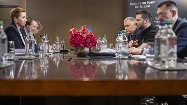 epa11414601 Ukrainian President Volodymyr Zelensky (2R) and Prime Minister of Denmark Mette Frederiksen (L) hold a bilateral meeting during the Summit on peace in Ukraine in Stansstad near Lucerne, Switzerland, 16 June 2024. International heads of state gather on 15 and 16 June at the Buergenstock Resort in central Switzerland for the two-day Summit on Peace in Ukraine. EPA/ALESSANDRO DELLA VALLE / POOL EDITORIAL USE ONLY