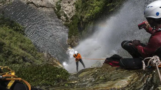 epa04773613 Nepalese Youth from Kathmandu canyoning in a waterfall in Pokhara, some 205 kms west of capital Kathmandu,Nepal, 29 May 2015. Middle class Nepalese from Kathmandu start visiting Pokhara to escape from earthquake trauma. Pokhara is a second tourist destination after Kathmandu in Nepal which survived damage from the 25 April earthquake, however the major tourism sector trekking, mountaineering were badly hit after earthquake. EPA/NARENDRA SHRESTHA