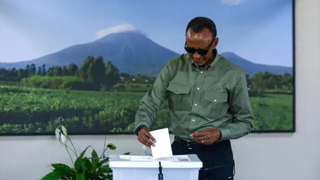 epa11479693 Rwandan President Paul Kagame casts his vote at SOS Technical High School in Kigali, Rwanda, 15 July 2024. Incumbent President of Rwanda Paul Kagame is seeking a fourth term as 9.7 million Rwandan citizens are eligible to vote to choose a president and members of parliament who will serve for the next five years. EPA/DANIEL IRUNGU