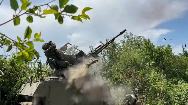 epa11427850 A still image taken from a handout video provided by the Russian Defence Ministry press service shows Russian servicemen of an anti-aircraft unit of the 'Center' group providing air cover for the positions of Russian motorized riflemen in the Avdeevka direction in the Russian-controlled part of Ukraine, Donetsk region, 21 June 2024. Throughout the night, Russian military personnel destroyed 114 Ukrainian aircraft-type drones over three regions, as well as six sea drones in the Black Sea, the Russian Defense Ministry said. EPA/RUSSIAN DEFENCE MINISTRY PRESS SERVICE/HANDOUT HANDOUT HANDOUT EDITORIAL USE ONLY/NO SALES HANDOUT EDITORIAL USE ONLY/NO SALES