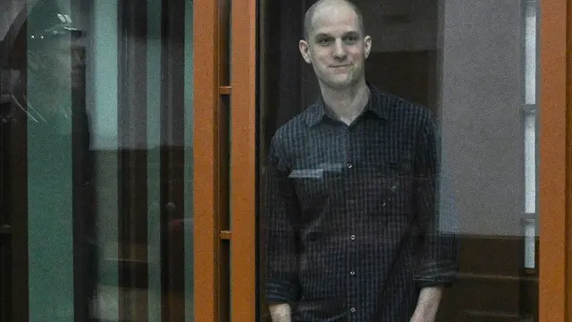 epa11439458 WSJ correspondent Evan Gershkovich stands in a glass cage prior to a hearing in Yekaterinburg's Sverdlovsk Regional Court, Yekaterinburg, Russia, 26 June 2024. Evan Gershkovich, a US journalist of The Wall Street Journal covering Russia, was detained in Yekaterinburg on 29 March 2023. The Russia's Federal Security Service (FSB) claimed that on the instructions of the American authorities, the journalist collected information constituting a state secret about one of the enterprises of the Russian military-industrial complex. He is charged with espionage under Art. 276 of the Criminal Code of the Russian Federation, which could carry a sentence of up to 20 years. EPA/STRINGER