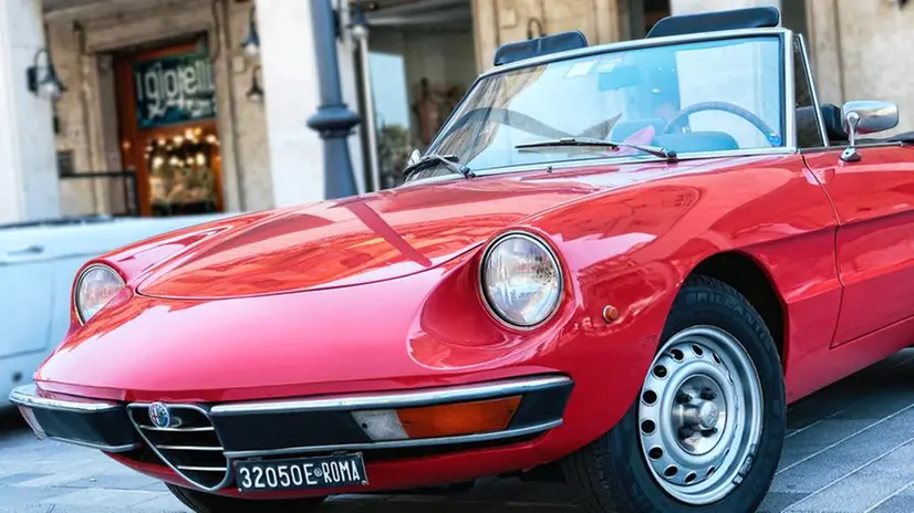 Rome,Italy - July 20, 2019:Rome capital city Rally event, an exhibition of vintage cars with beautiful red sport car model Alfa Romeo 1300 also called Duetto manufactured by Italian Alfa Romeo since 1966