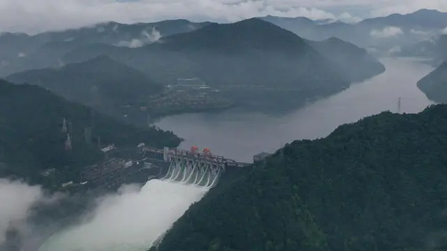 epa11434688 An aerial view taken with a drone shows the Xin'an River Reservoir releasing water for flood control in Jiande City, east China's Zhejiang Province, 24 June 2024. China's State Flood Control and Drought Relief Headquarters on 24 June, raised emergency responses to flooding to Level III in the eastern province of Zhejiang. Since 3:30 pm on 24 June, five spillway tunnels of the Xin'an River Reservoir have been opened to release water for flood control. The Xin'an River Hydropower Station, a water control hub on the main stream of the upper Qiantang River, has put all its generator units into full-capacity operation. EPA/XINHUA / HUANG ZONGZHI CHINA OUT / UK AND IRELAND OUT / MANDATORY CREDIT EDITORIAL USE ONLY EDITORIAL USE ONLY