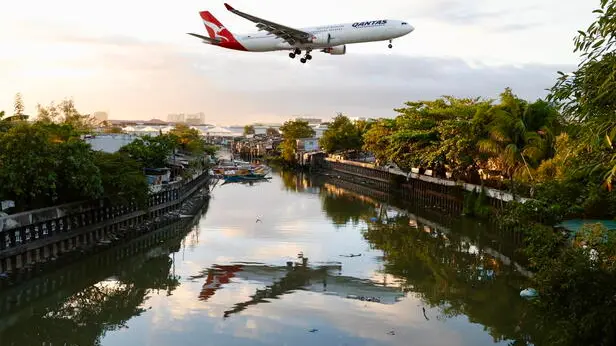 epa11174636 A Qantas Air Lines plane lands at Manilaâ€™s international airport, Philippines, 23 February 2024. Manilaâ€™s international airport, routinely ranked as one of the world's worst airports, will be upgraded and operated by top bidder San Miguel Corporation (SMC). The Philippine government awarded a three billion U.S. dollar contract for 15 years to SMC consortium owned by billionaire Ramon Ang. EPA/FRANCIS R. MALASIG