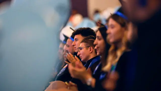 epa11470273 Students listen to the dean's speech while attending the diploma ceremony after completing a four-year degree at the National University of Science and Technology Politehnica Bucharest, at the Aula-Manga Great Hall in Bucharest, Romania, 10 July 2024. During the ceremony, the heads of promotion from all departments of the university recited the professional oath. In 2024, approximately 10,000 graduates completed their bachelor's and master's degree studies at UPB. The Politehnica University of Bucharest, founded in 1864, is the oldest higher education institution in Bucharest. It is also the largest technical university in the country, with 15 faculties and approximately 25,000 students. EPA/ROBERT GHEMENT