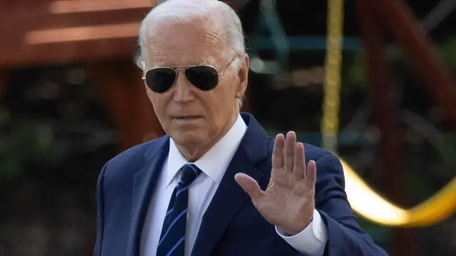 epa11480543 US President Joe Biden waves as he walks across the South Lawn to depart the White House by Marine One, in Washington, DC, USA, 15 July 2024. Biden travels to Las Vegas, Nevada. EPA/MICHAEL REYNOLDS