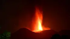 epaselect epa11480941 The Mount Etna volcano spews lava during an eruption in Sicily island, Italy, 15 July 2024 (issued 16 July 2024). Mount Etna's Voragine crater spewed lava through the night, with a column of ash that reached an altitude of about 6,000 meters above sea level. EPA/ORIETTA SCARDINO