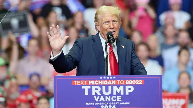 epa11489815 Republican presidential nominee Donald J. Trump speaks at his first joint rally with Republican vice presidential nominee Senator JD Vance at Van Andel Arena in Grand Rapids, Michigan, USA, 20 July 2024. EPA/ALLISON DINNER