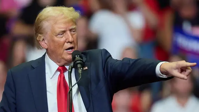 epa11489818 Republican presidential nominee Donald J. Trump speaks at his first joint rally with Republican vice presidential nominee Senator JD Vance at Van Andel Arena in Grand Rapids, Michigan, USA, 20 July 2024. EPA/ALLISON DINNER