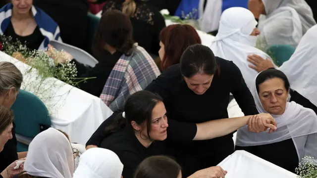 epa11501365 Druze people attend the funeral of ten young people killed by a rocket attack from Lebanon, in the village of Majdal Shams in the annexed Golan Heights, 28 July 2024. According to the Israel Defense Forces (IDF), a rocket launched from Lebanon toward Majdal Shams caused multiple civilian casualties, including children. Approximately 30 projectiles were identified as crossing from Lebanon, the IDF said. EPA/ATEF SAFADI