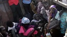 epa10629408 South Sudanese returnees who fled the armed conflict in Sudan, wait for other passengers to embark on the boat for their next journey to the south, in the Upper Nile State town of Renk, South Sudan, 14 May 2023 (issued 15 May 2023). According to Mohajer Mhadi Khalifa, head of the boats union in charge of regulating the transport on the Nile in Renk, five boats are planned to transport the returnees to their areas of origin on the Nile towards the Southern Town of Malakal and other locations. On 14 May 2023 a group of 348 people embarked for the trip, following 577 others who made the same trip the previous day after days of waiting in the fluvial port of Renk. The transport was coordinated and organized by the IOM, Caritas and the RCC (the South Sudanese Relief and Rehabilitation Commission). According to the United Nations, some 200,000 people have fled the conflict in Sudan between 15 April and 12 May 2023. Most of them left towards neighboring countries such as Egypt, Tchad, South Sudan or Ethiopia, and about two million people were internally displaced. Leaving behind them the armed conflict between the Sudanese military and the RSF (Rapid Support Forces) militia, most of the refugees in South Sudan are South Sudanese returnees, part of the some 800,000 who had previously fled the war in South Sudan and who are now returning to a country which is barely out of conflict itself with tensions still remaining in many areas. EPA/AMEL PAIN ATTENTION: This Image is part of a PHOTO SET