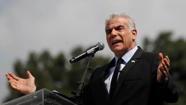 epa10545326 Former Israeli prime minister Yair Lapid adresses a rally against the judical overhaul plan outside the Knesset in Jerusalem, Israel, 27 March 2023. Mass protests have been held in Israel for 12 weeks against the government's plans to reform the justice system and limit the power of the Israeli Supreme Court. EPA/ATEF SAFADI