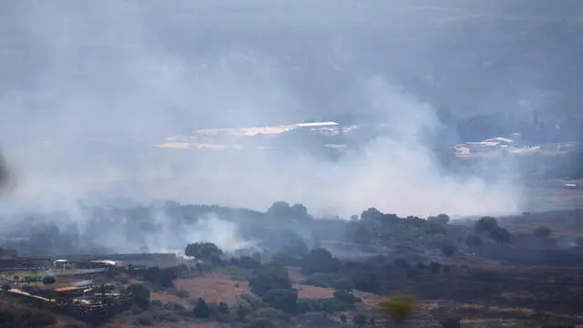 epa11399883 Smoke from a fire following strikes from Lebanon, near Banias, in the Israeli-annexed Golan Heights, 09 June 2024. The Israeli military stated on 09 June, that 'hostile aircraft' entered northern Israel, two unmanned aerial vehicles (UAVs) were identified crossing from Lebanon. The aircraft fell in the northern Golan Heights area and no injuries were reported, the statement added. As a result of the UAV attacks, fires were ignited in the area and Israeli firefighters responded to the scene to extinguish the fires. EPA/ATEF SAFADI