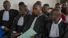 epa11316932 The lawyers of 11 soldiers on trial sit in a military court waiting for the verdict in Goma, Democratic Republic of Congo, 03 May 2024. The military court handed a death sentence to eight soldiers, including five officers, for 'cowardice' and 'flight from the enemy' when fighting M23 rebels, the three others were acquitted. The soldiers were based at an army position close to the strategic town of Sake, 20 kilometers from Goma, the capital of North Kivu. The Congolese government announced on 13 March 2024 the resumption of executions, particularly against soldiers accused of treason. EPA/MOISE KASEREKA