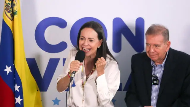 epa11507672 Opposition leader Maria Corina Machado (L) speaks during a press conference with the Presidential candidate to the Venezuelan elections Edmundo Gonzalez Urrutia (R) in Caracas, Venezuela, 29 July 2024. Machado said that the opposition obtained 73 % of the vote tallies, saying they can prove they won the presidential elections that took place on 28 July. The Venezuelan National Electoral Council (CNE) has proclaimed that Nicolas Maduro was re-elected president of Venezuela. EPA/Manuel Diaz