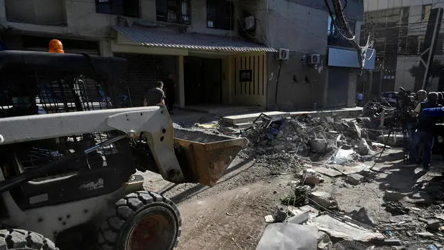 epa11510824 Municipal workers remove debris at the site of an Israeli strike the previous day in Beirut, Lebanon, 31 July 2024. Lebanon's state media said an Israeli drone targeted an area in the Haret Hreik neighborhood of Beirut. Israel Defense Forces (IDF) announced to have killed Hezbollah's senior military commander Fuad Shukr in a 'targeted strike' in Beirut on 30 July. EPA/WAEL HAMZEH