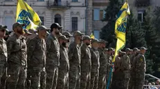 epa11503767 Servicemen of the Azov battalion attend a ceremony to remember the victims of the Olenivka camp explosion, on the Independence Square in Kyiv, 28 July 2024, amid the Russian invasion. On 29 July 2022 a building housing Ukrainian prisoners of war in Olenivka, eastern Ukraine, was destroyed, killing more than 50 people. According to Ukraine, the majority of the prisoners were soldiers from the Azovstal complex of Mariupol. Ukraine and Russia accused each other of being behind the attack. EPA/SERGEY DOLZHENKO