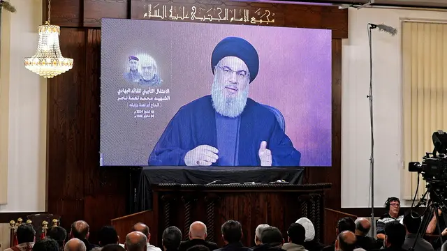epa11470552 Hezbollah leader Hassan Nasrallah delivers a televised speech during a memorial service for Hezbollah fighter Muhammad Nimeh Nasser, in Beirut, Lebanon, 10 July 2024. Nasrallah said his group will cease attacks on Israel if a ceasefire agreement was reached between Hamas and Israel. Hezbollah announced in statement that Nasser was killed in an Israeli airstrike on southern Lebanon on 03 July. EPA/ABBAS SALMAN