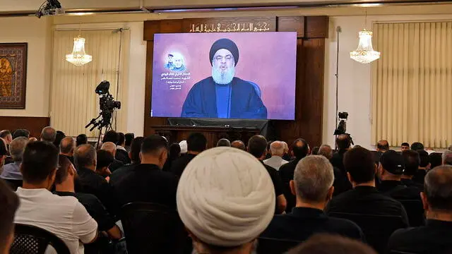 epa11470517 Hezbollah leader Hassan Nasrallah delivers a televised speech during a memorial service for Hezbollah fighter Muhammad Nimeh Nasser, in Beirut, Lebanon, 10 July 2024. Nasrallah said his group will cease attacks on Israel if a ceasefire agreement was reached between Hamas and Israel. Hezbollah announced in statement that Nasser was killed in an Israeli airstrike on southern Lebanon on 03 July. EPA/ABBAS SALMAN