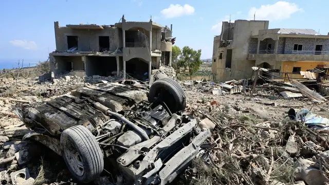 epa11518425 Damaged buildings at the site of an Israeli strike in the village of Shama, southern Lebanon, 02 August 2024. Lebanon's state media said at least four Syrian nationals were killed and five Lebanese nationals were injured during an Israeli strike on Shama village on 01 August. Hezbollah announced it launched Katyusha rockets in response. EPA/STR