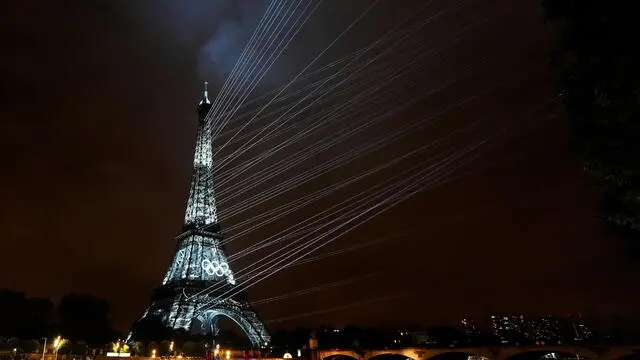 epa11498168 The Eiffel Tower is illuminated by a light show during the Opening Ceremony of the Paris 2024 Olympic Games, in Paris, France, 26 July 2024. EPA/DAVID DAVIES / POOL