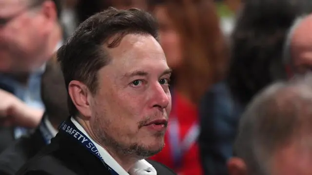 epa10952305 Chief executive officer of Tesla Inc. Elon Musk (C) attends the AI Safety Summit 2023 at Bletchley Park in Bletchley, Britain, 01 November 2023. The two-day summit was prompted by UK concerns about powerful artificial intelligence models expected to be released next year, which will have capabilities the government fears not even developers understand. EPA/CHRIS J. RATCLIFFE / POOL