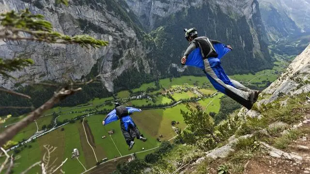 epa03834923 (FILE) Two BASE (Buildings, Antennas, Spans and Earth) jumpers fall after leaping from the exit point High Nose (550 meters high) in the valley of Lauterbrunnen, pictured on 14 August 2011. Spanish TV presenter and sportsman Alvaro Bulto, who used to date Spanish Princess Cristina, has died while practicing wingflying in the valley of Lauterbrunnen, on 23 August 2013. EPA/GAETAN BALLY NO SALES/NO ARCHIVES