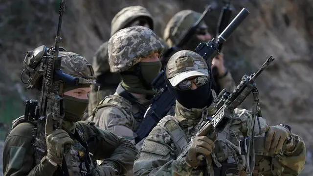 epa11270134 Members of the 'Siberian Battalion' attend their military training on a shooting range near Kyiv, Ukraine, 10 April 2024. The 'Siberian Battalion' military unit was formed as part of the International Legion of the Ukrainian Armed Forces and contains Russian nationals, former military personnel, civil activists and volunteers who choose to fight against Russian troops in Ukraine. Ukraine-aligned Russian fighters from 'Russian Volunteer Corps', 'Siberian Battalion' and 'Freedom of Russia Legion', have been carrying out cross-border raids inside Russiaâ€™s Belgorod and Kursk regions in March 2024. EPA/SERGEY DOLZHENKO