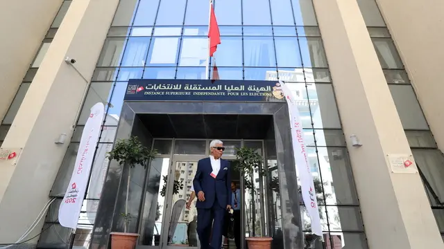 epa11530808 Former Tunisian MP, journalist and writer Ahmed Safi Said leaves after submiting his candidacy for the upcoming presidential elections, at the Independent Higher Authority for the Elections in Tunis, Tunisia, 06 August 2024. Tunisia's Presidential elections are scheduled on 06 October 2024. EPA/MOHAMED MESSARA