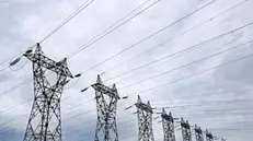 epa10779996 Electricity pylons of high-voltage electrical power lines pictured in Montarnaud, near Montpellier, France, 01 August 2023. Prices of regulated household electricity rose by 10 percent in France starting from 01 August following a government decision taken in July. The French Energy Regulatory Commission earlier claimed a much higher increase of 74.5 percent based on the current market prices. EPA/Guillaume Horcajuelo