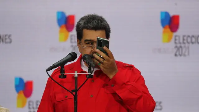 epa09596736 The President of Venezuela, Nicolas Maduro, speaks on a phone as he makes public statements during the local and regional elections in Caracas, Venezuela, 21 November 2021. More than 21 million Venezuelans are called to vote to choose 23 governors, 335 mayors, 253 legislators from legislative councils and 2,471 councilors. The regional and local elections in Venezuela are also being observed by a mission of more than 100 people from the European Union (EU), who had not attended an electoral event in the Caribbean country for 15 years EPA/Miguel Gutierrez