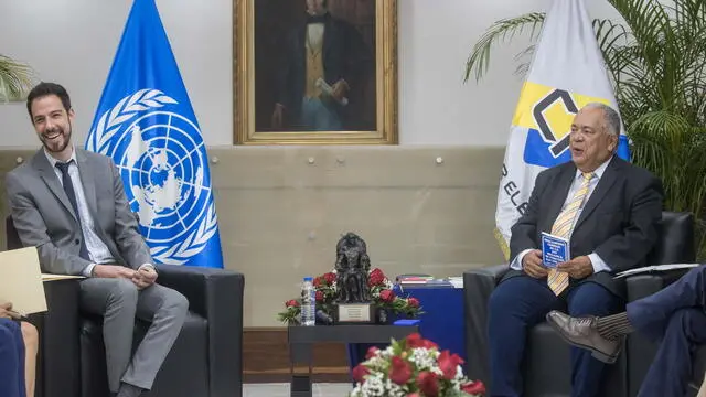 epa11296383 President of the National Electoral Council, Elvis Amoroso (R) meets with the Electoral affairs officer and boss of the delegation of the UN, Jorge Alberto Grayeb Munayer (L) during an encounter in Caracas, Venezuela, 23 April 2024. The UN committee will hold different reunions with representatives members of the public power and different politics associations. EPA/Miguel Gutierrez