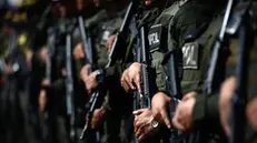 epa11408610 Police officers form prior to a patrol in the municipality of Jamundi, Colombia, 13 June 2024. A total of 100 police officers arrived on 13 June to reinforce security in the municipality of Jamundi, in southwestern Colombia, that suffered two terrorist attacks on 12 June at the hands of FARC dissidents. EPA/Ernesto Arias