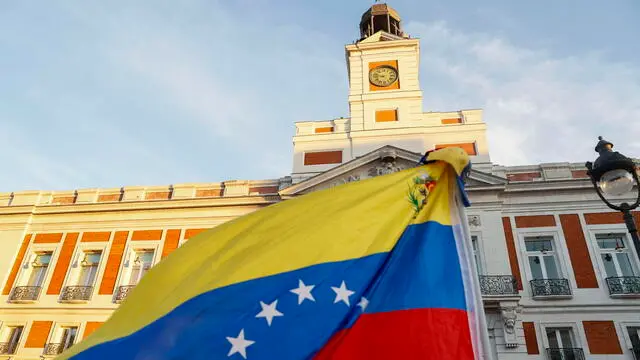 epa11553434 A Venezuelan flag flutters during a demonstration against the official results of Venezuela's presidential elections, in Madrid, Spain, 17 August 2024. The Venezuelan National Electoral Council (CNE) ratified the victory of Nicolas Maduro in Venezuela's presidential elections held on 28 July 2024, while the opposition have been protesting against the official results claiming the victory of Edmundo Gonzalez Urrutia. EPA/FERNANDO ALVARADO