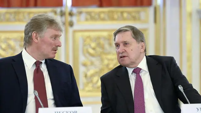 epa10561677 Kremlin spokesman Dmitry Peskov (L) and Russian Presidential Aide Yuri Ushakov attend a meeting of the Supreme State Council of the Union State of Russia and Belarus at the Kremlin in Moscow, Russia, 06 April 2023. Putin supported the proposal of the Belarusian leader Lukashenko to extend the previous agreements in the field of security. On 25 March, the Russian president issued new threats against Western countries supporting Ukraine, announcing an agreement with the Belarusian ruler to deploy tactical nuclear weapons in the country. EPA/ALEXANDER ASTAFYEV/SPUTNIK/KREMLIN POOL MANDATORY CREDIT