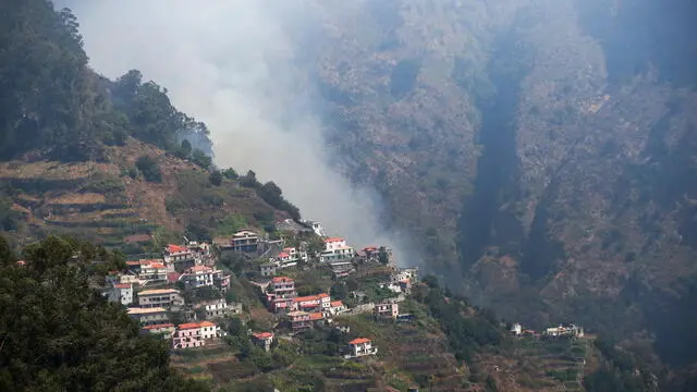 epa11554213 General view of a fire in Madeira Island, Portugal, 18 August 2024. The fire, which started on 14 August in the municipality of Ribeira Brava and spread the following day to the neighboring municipality of Camara de Lobos, is now active on three fronts and is being fought by 120 operational, 43 vehicles and one aircraft, with the region having the support of 76 members of the joint force of the National Emergency and Civil Protection Authority. EPA/HOMEM DE GOUVEIA