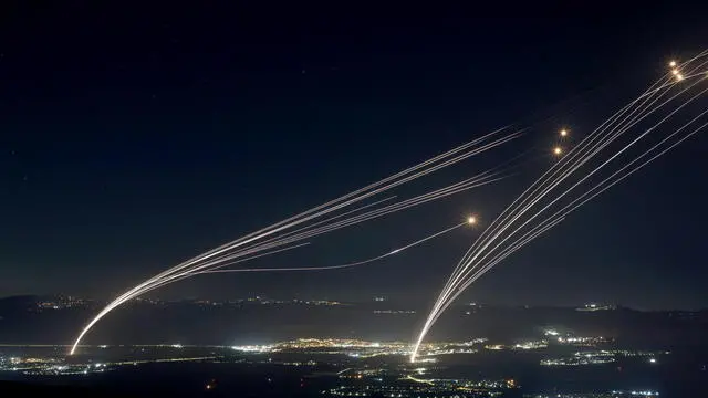 epa11523722 Projectiles fired from the Israeli Iron Dome air defense system to intercept missiles fired from southern Lebanon, over the upper Galilee, northern Israel, early 04 August 2024. The Israeli army reported that around 50 missiles were launched from southern Lebanon into Israel territories. On 03 August the IDF had reported to have struck Hezbollah targets in southern Lebanon. EPA/ATEF SAFADI