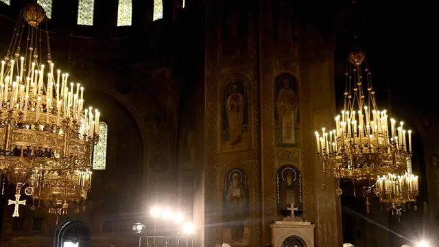 epa11447370 The new Bulgarian Patriarch Daniel (C) blesses the congregation during his enthronement at Alexander Nevsky cathedral in Sofia, Bulgaria, 30 June 2024. A Church council in Bulgaria elected Daniel as the new patriarch (head) of the country's Orthodox church. The election was followed by a solemn procession from the Holy Synod building to the Alexander Nevsky cathedral. At the end of the enthronization ceremony, the new Patriarch was to step to the throne, when two bishops promulgated three times 'worthy' for him, followed by the clergy and then the laity. EPA/VASSIL DONEV