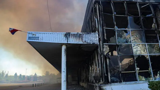 epa11551616 Smoke rises following the shelling of Galaktika shopping centre in downtown of Donetsk, Russia, 16 August 2024. The number of victims as a result of the strike by the Armed Forces of Ukraine on the Galaktika shopping centre in Donetsk has grown to 11, the press service of the DPR Ministry of Health reports. According to Pushilin, the area of â€‹â€‹the fire in the Galaktika shopping center exceeded 10 thousand square meters. He added that there is a teenager among the victims, and information about the wounded continues to come in. Firefighters are unable to begin extinguishing the fire due to ongoing shelling of the surrounding area. The head of the DPR confirmed that rescuers are moving to a safe distance from the building due to the operational situation. He also reported damage to the building of the Central City Hospital No. 14. EPA/ALESSANDRO GUERRA