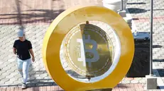 epa11474675 The bitcoin symbol in Plaza San Bartolome in Ilopango, El Salvador, 11 July 2024 (issued 12 July 2024). The adoption of bitcoin as legal tender in El Salvador, a project promoted and promoted by the Government of President Bukele to promote financial inclusion, attract foreign investment and improve the economy, does not convince the majority of the population who refuse to use it on a daily basis almost three years after its validity. EPA/Rodrigo Sura