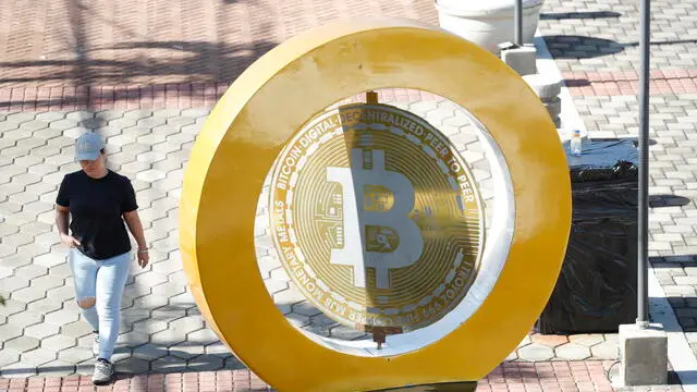 epa11474675 The bitcoin symbol in Plaza San Bartolome in Ilopango, El Salvador, 11 July 2024 (issued 12 July 2024). The adoption of bitcoin as legal tender in El Salvador, a project promoted and promoted by the Government of President Bukele to promote financial inclusion, attract foreign investment and improve the economy, does not convince the majority of the population who refuse to use it on a daily basis almost three years after its validity. EPA/Rodrigo Sura