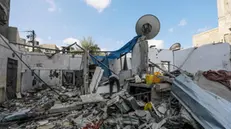 epa11548253 A Palestinian inspects a destroyed house following an Israeli air strike in Al Maghazi refugee camp, Gaza Strip, 14 August 2024. The Palestinian Health Ministry in Gaza said at least six Palestinians were killed from the Eid family in the Israeli strike in the Al Maghazi refugee camp and more than 10 others were injured. More than 39,500 Palestinians and over 1,400 Israelis have been killed, according to the Palestinian Health Ministry and the Israel Defense Forces (IDF), since Hamas militants launched an attack against Israel from the Gaza Strip on 07 October 2023, and the Israeli operations in Gaza and the West Bank which followed it. EPA/MOHAMMED SABER