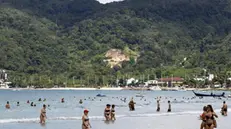 epa04538638 A photo made available on 23 December 2014 shows foreign tourists enjoy on the 2004 tsunami hit Patong beach, Phuket island, southern Thailand, 30 November 2014. Ceremonies across Phuket and Phang Nga are held to mark the ten year anniversary of the Boxing Day tsunami which struck 26 December 2004. More than 5,000 people were killed in Thailand, many of them foreigners vacationing in the area, among more than 280,000 who were killed or are missing as the devastating waves struck 14 nations on the Indian Ocean. EPA/YONGYOT PRUKSARAK