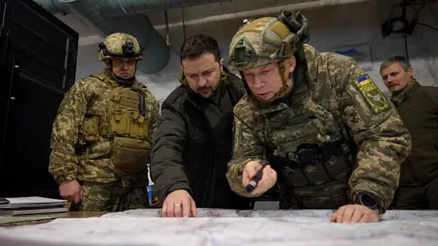 epa11003554 A handout photo made available by the presidential press service shows Ukrainian President Volodymyr Zelensky (C) taking part in a meeting with commanders at the headquarters of the Defense Forces near a frontline close to Kupiansk during his working trip to Kharkiv region, Ukraine, 30 November 2023. President Zelenskyy and Defense Minister Rustem Umerov listened to a report on the operational situation in that area and hand State awards to Ukrainian servicemen. EPA/PRESIDENTIAL PRESS SERVICE HANDOUT HANDOUT 36225 HANDOUT EDITORIAL USE ONLY/NO SALES HANDOUT EDITORIAL USE ONLY/NO SALES