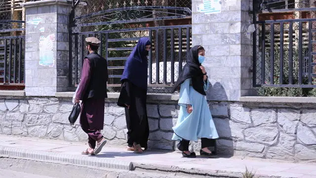 epa11564446 Afghan women walk on a road in Kabul, Afghanistan, 25 August 2024. The Taliban in Afghanistan have recently enforced new laws mandating that women must cover their bodies and faces in public, citing these measures as necessary to promote virtue and prevent vice, the Ministry for the Propagation of Virtue and Prevention of Vice said. Approved by their Supreme Leader Hibatullah Akhundzada, the regulations include restrictions on women's voices in public, the prohibition of images of living beings, and bans on music and mixed-gender interactions. The measures have drawn criticism from the United Nations (UN) for fostering fear and intimidation, especially among women and girls, as the Taliban's Ministry for the Propagation of Virtue and Prevention of Vice expands its control over public life. EPA/SAMIULLAH POPAL