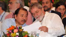 epa02742754 Brazilian former president Luiz Inacio Lula da Silva (R) talks to Nicaraguan President Daniel Ortega (L) during the 17th Forum of Sao Paulo in Managua, Nicaragua, 19 May 2011. The event is centered on international affairs such as the definitive solution of Honduran crisis and the rebellions in Arab countries. EPA/MARIO LOPEZ