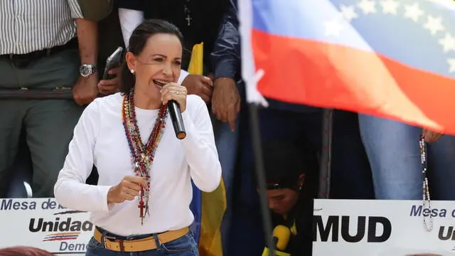epa11523475 Venezuelan opposition leader Maria Corina Machado speaks at a protest against the official results of the country's 28 July presidential elections in Caracas, Venezuela, 03 August 2024. The Venezuelan National Electoral Council (CNE) on 02 August 2024 proclaimed Nicolas Maduro as re-elected president of Venezuela. EPA/RONALD PENA R.