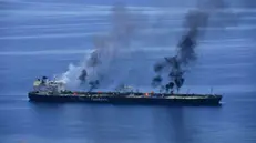 epa11568962 A handout photo made available by EUNAVFOR Aspides shows flames and smoke rising from the Greek-flagged oil tanker Sounion following Yemen's Houthis attacks, in the Red Sea, 25 August 2024 (issued 28 August 2024). The Greek-flagged oil tanker, which has been on fire since 23 August in the Red Sea, following Yemen's Houthis attacks, is still burning and now appears to be leaking oil, a US Pentagon spokesman said.Yemen's Houthis have claimed responsibility for a two-small boats and three projectiles attack against the oil tanker Sounion in the Red Sea off Yemen on 21 August 2024, Houthi military spokesman Yahya Sarea said in a statement. EPA/EUNAVFOR ASPIDES HANDOUT HANDOUT EDITORIAL USE ONLY/NO SALES