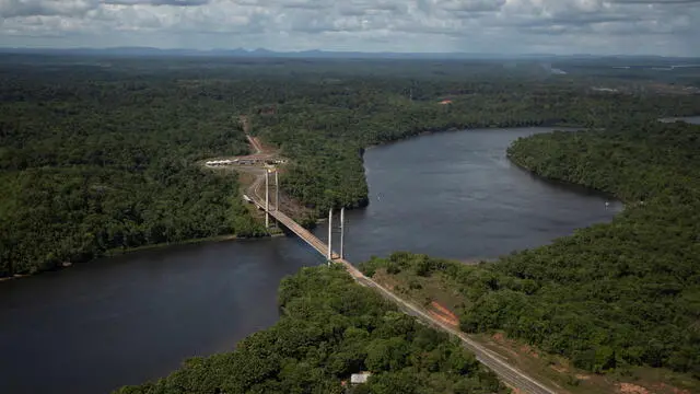 epa08790201 View of the Binational Bridge during a military training session on the Oiapoque River, on the border between Brazil and French Guiana, in Oiapoque, Brazil, 31 October 2020. The training is part of Operation Agata, the goal of which is to carry out preventive and repressive actions, jointly employing portions of the Armed Forces and in coordination with federal and state public and environmental security bodies, in the land border and inland waters, in order to restrict and combat environmental and cross-border crimes. EPA/Joedson Alves